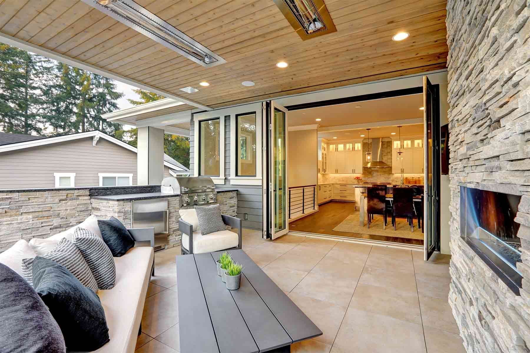 Multi-slide patio doors opening to covered patio with outdoor kitchen Knoxville