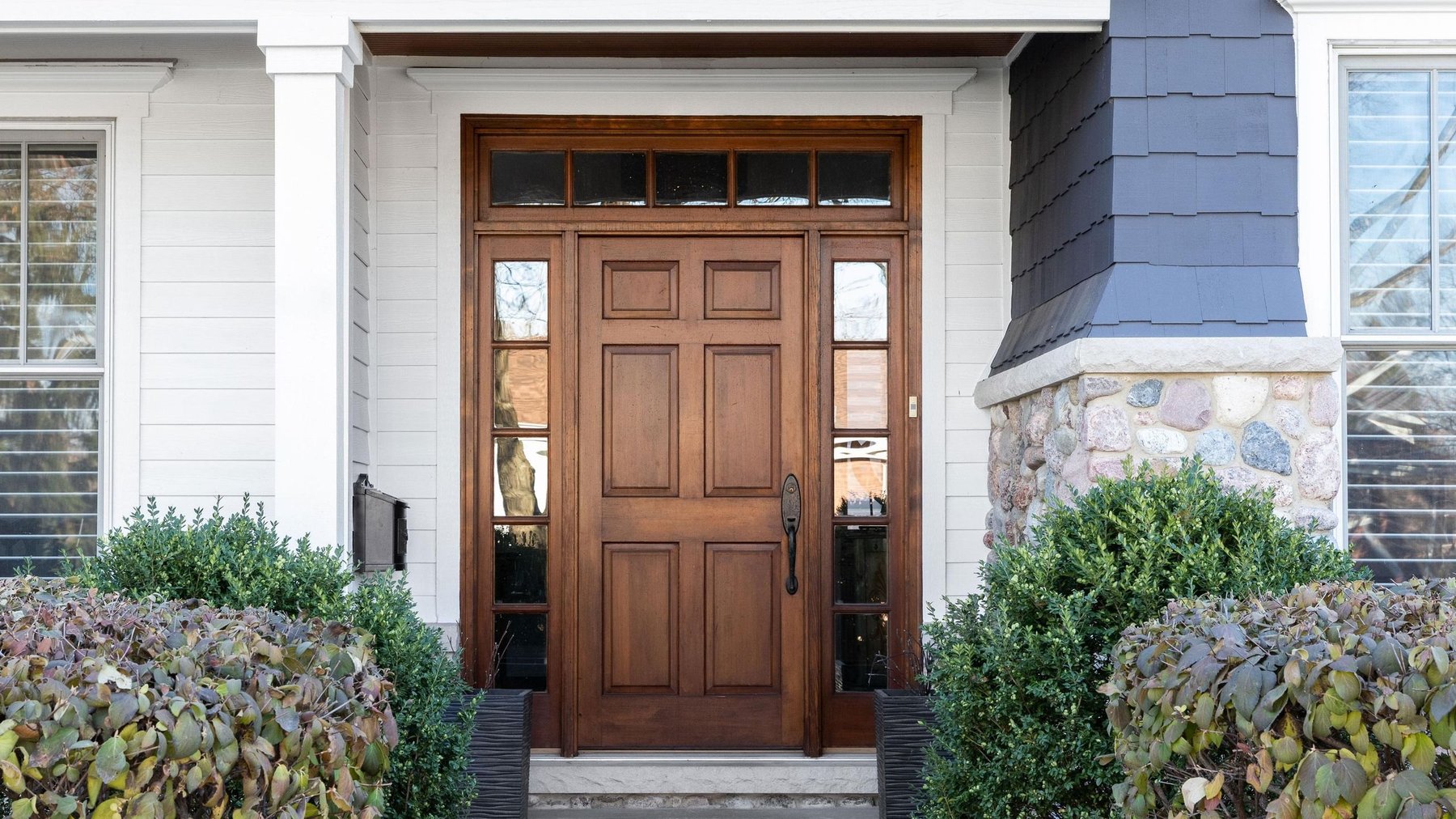 Stained solid wood entry door with sidelites and transom Knoxville