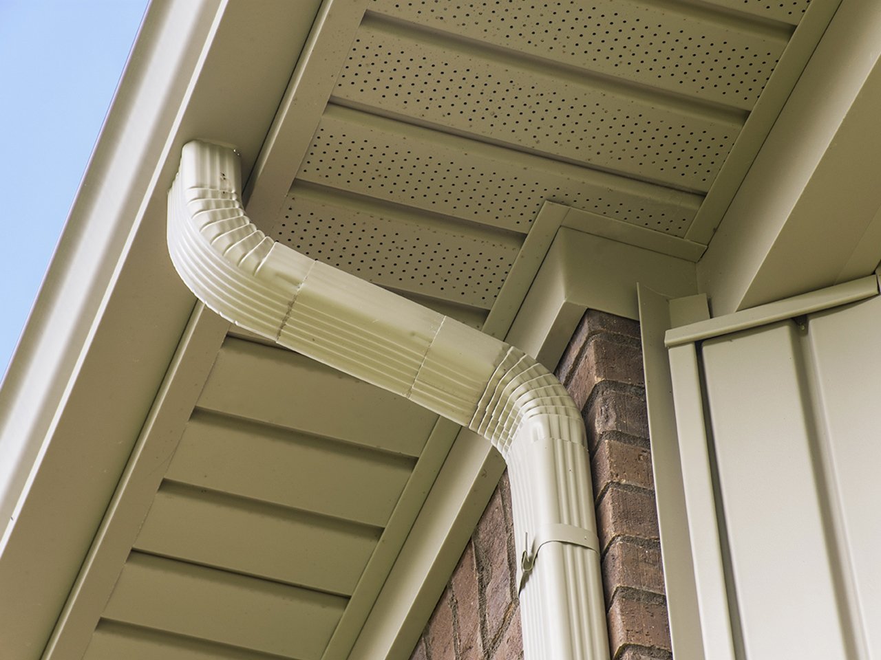Seamless downspout elbow detail with vented soffit Knoxville