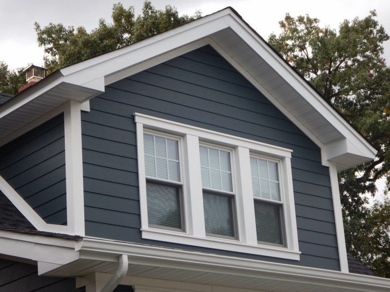 Dark blue vinyl lap siding with white trim Knoxville